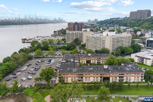 1111 River Rd Unit F25, Edgewater, NJ 07020 - aerial overview of property's location featuring city skyline and a large body of water