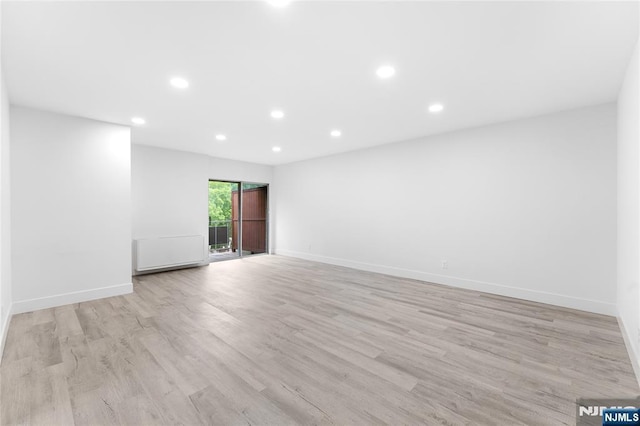 1111 River Rd Unit F25, Edgewater, NJ 07020 - empty room featuring recessed lighting, light wood-style floors, and baseboards
