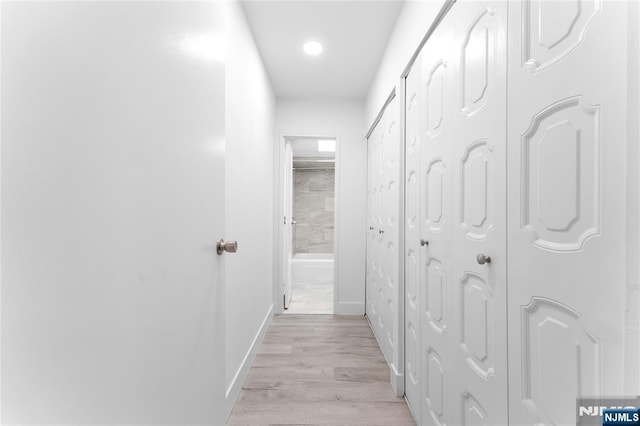 1111 River Rd Unit F25, Edgewater, NJ 07020 - hall with light wood-style flooring, baseboards, and recessed lighting