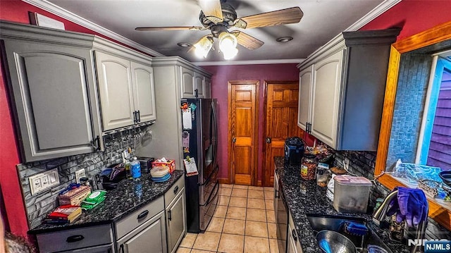 18 Trinity Pl, Kearny, NJ 07032 - kitchen with stainless steel fridge, a ceiling fan, light tile patterned floors, tasteful backsplash, and crown molding