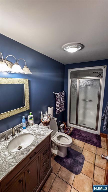 18 Trinity Pl, Kearny, NJ 07032 - full bath with vanity, a shower stall, toilet, and tile patterned floors