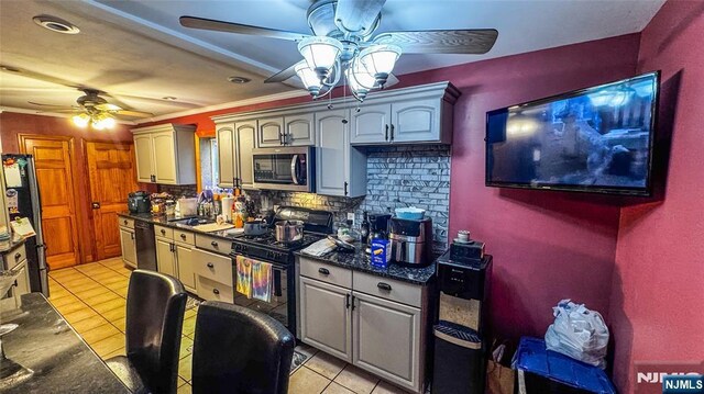 18 Trinity Pl, Kearny, NJ 07032 - kitchen featuring a ceiling fan, black appliances, dark countertops, light tile patterned floors, and ornamental molding
