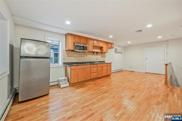 445B 7th St Unit B, Palisades Park, NJ 07650 - kitchen featuring appliances with stainless steel finishes, a baseboard heating unit, light wood-style flooring, a wall mounted AC, and recessed lighting