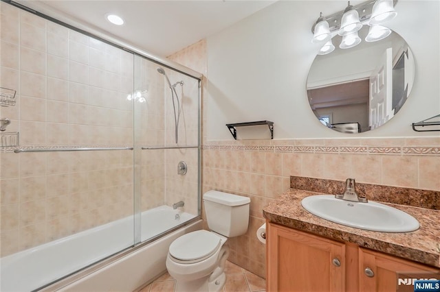 445B 7th St Unit B, Palisades Park, NJ 07650 - full bath with vanity, tile walls, shower / bath combination with glass door, tile patterned floors, and a wainscoted wall