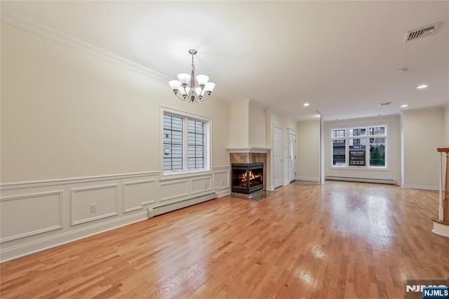 445B 7th St Unit B, Palisades Park, NJ 07650 - unfurnished living room with a baseboard radiator, baseboard heating, healthy amount of natural light, a chandelier, and ornamental molding