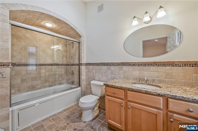 445B 7th St Unit B, Palisades Park, NJ 07650 - bathroom with tile walls, vanity, enclosed tub / shower combo, and wainscoting