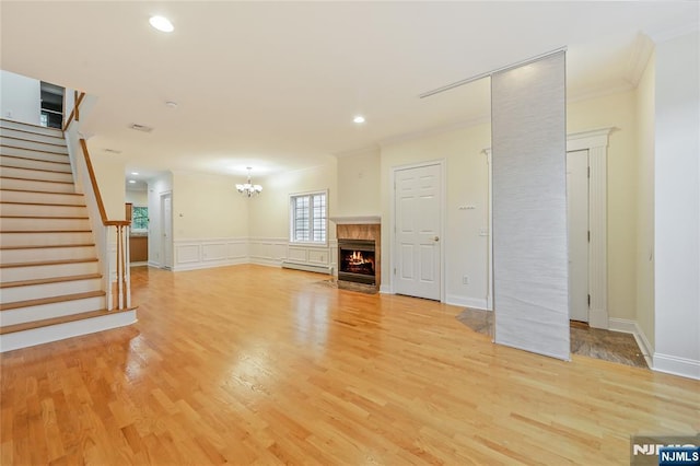 445B 7th St Unit B, Palisades Park, NJ 07650 - unfurnished living room featuring ornamental molding, baseboard heating, light wood-style floors, a chandelier, and stairway