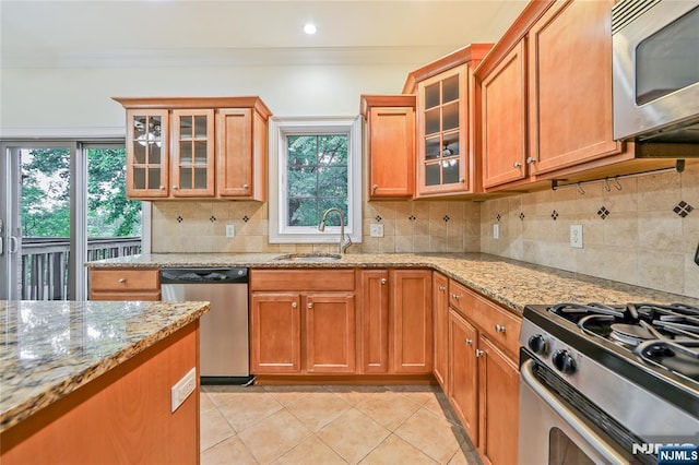 445B 7th St Unit B, Palisades Park, NJ 07650 - kitchen featuring appliances with stainless steel finishes, light stone counters, ornamental molding, and light tile patterned floors
