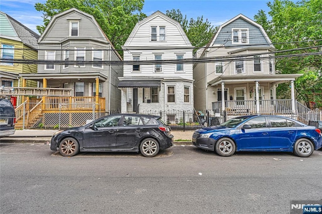 832 15th St, Newark, NJ 07108 - colonial inspired home featuring a gambrel roof and covered porch