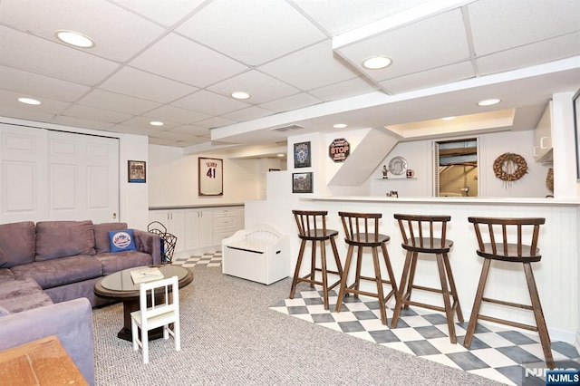145 Concord Dr, River Edge, NJ 07661 - living room featuring bar, recessed lighting, tile patterned floors, and a paneled ceiling