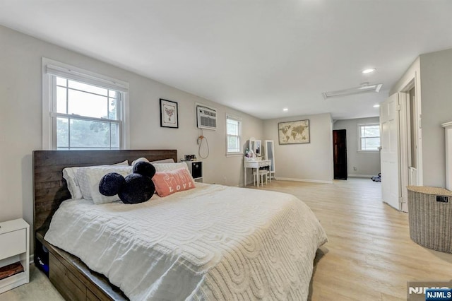 236 Vanderburgh Ave, Rutherford, NJ 07070 - bedroom with multiple windows, light wood-style flooring, attic access, recessed lighting, and a wall mounted air conditioner