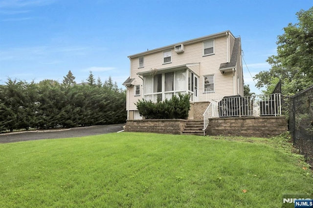 236 Vanderburgh Ave, Rutherford, NJ 07070 - back of house with a yard and a wall mounted air conditioner