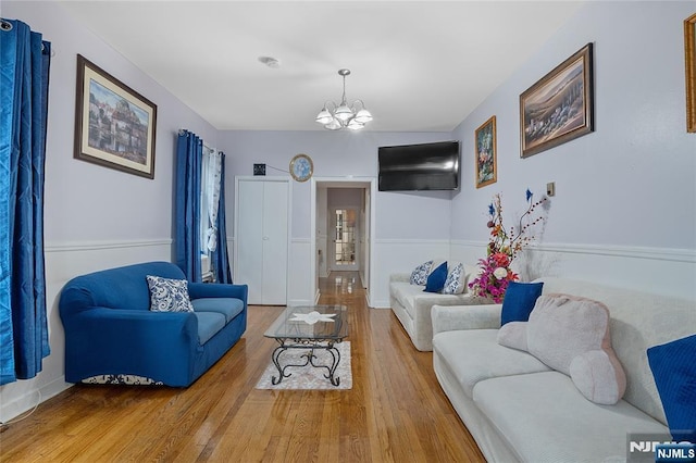548 Jefferson Ave, Elizabeth, NJ 07201 - living area featuring a chandelier and wood finished floors