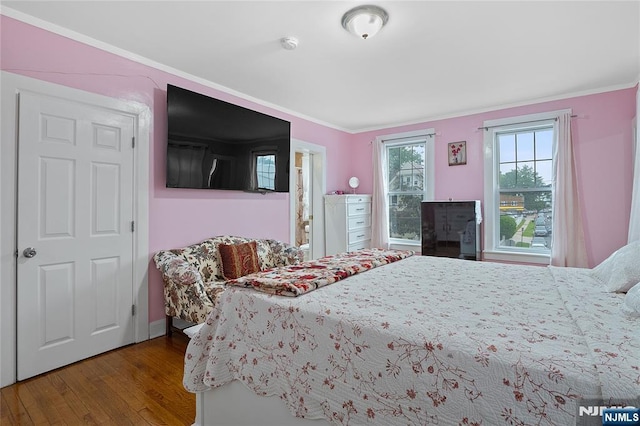 548 Jefferson Ave, Elizabeth, NJ 07201 - bedroom with wood finished floors, crown molding, and baseboards