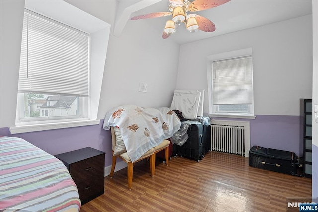 548 Jefferson Ave, Elizabeth, NJ 07201 - bedroom with radiator heating unit, wood finished floors, and ceiling fan