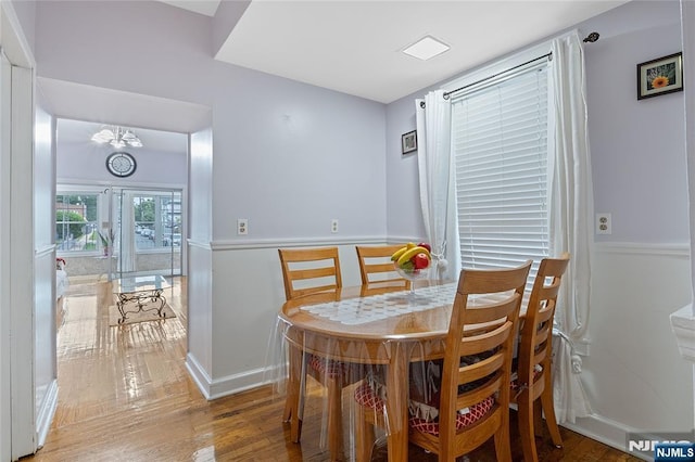 548 Jefferson Ave, Elizabeth, NJ 07201 - dining room with wood finished floors, a chandelier, and baseboards