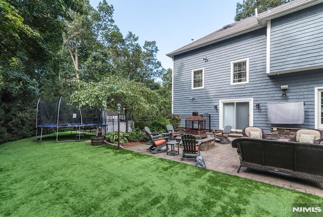 87 Skytop Dr, Mahwah, NJ 07430 - back of house featuring a trampoline, a patio area, and an outdoor living space
