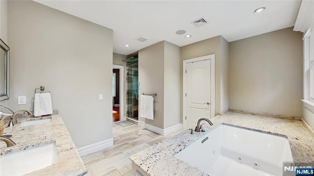 87 Skytop Dr, Mahwah, NJ 07430 - full bath with double vanity, a stall shower, a tub with jets, and recessed lighting