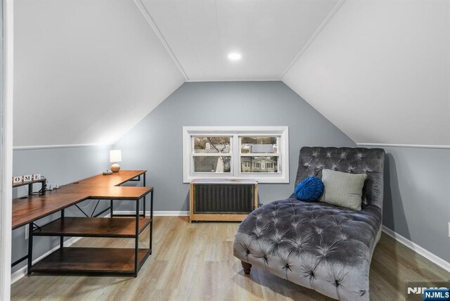518 Bloomfield Ave, Nutley, NJ 07110 - living area featuring wood finished floors, radiator, vaulted ceiling, a desk, and baseboards