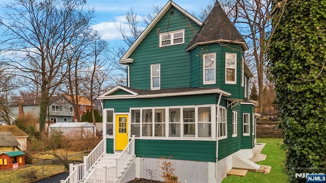 518 Bloomfield Ave, Nutley, NJ 07110 - view of front facade with a sunroom and roof with shingles