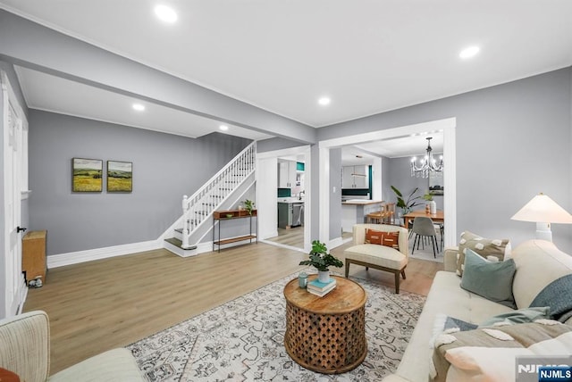 518 Bloomfield Ave, Nutley, NJ 07110 - living room featuring stairs, wood finished floors, recessed lighting, baseboards, and a chandelier