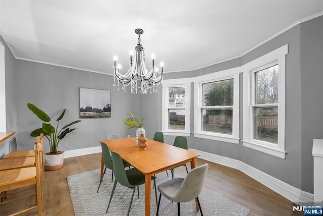 518 Bloomfield Ave, Nutley, NJ 07110 - dining room featuring a chandelier, baseboards, wood finished floors, and ornamental molding