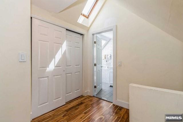 129 Phelps Ave, Englewood, NJ 07631 - foyer featuring wood finished floors, lofted ceiling, a skylight, and baseboards