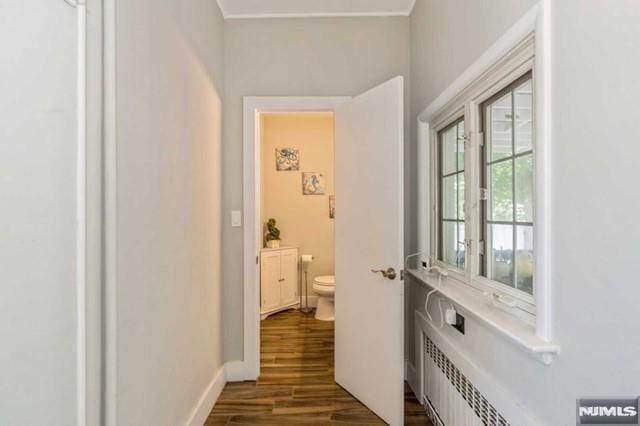 129 Phelps Ave, Englewood, NJ 07631 - hallway featuring dark wood-type flooring and baseboards