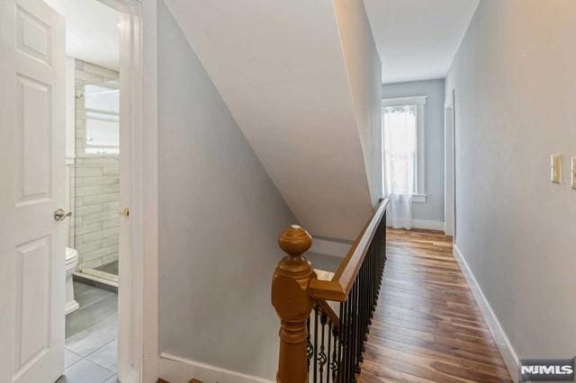 129 Phelps Ave, Englewood, NJ 07631 - staircase featuring baseboards and wood finished floors