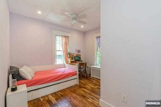 129 Phelps Ave, Englewood, NJ 07631 - bedroom with radiator heating unit, wood finished floors, recessed lighting, baseboards, and a ceiling fan