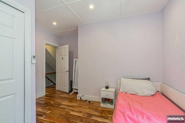 129 Phelps Ave, Englewood, NJ 07631 - bedroom with wood finished floors, recessed lighting, and baseboards