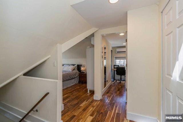 129 Phelps Ave, Englewood, NJ 07631 - corridor featuring dark wood-style flooring, a wall mounted air conditioner, an office area, vaulted ceiling, and recessed lighting