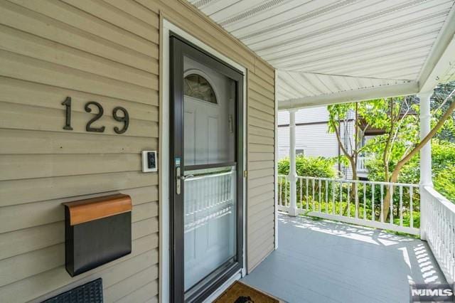 129 Phelps Ave, Englewood, NJ 07631 - doorway to property with covered porch