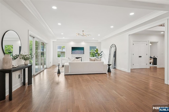 107 Rutland Rd, Glen Rock, NJ 07452 - living room featuring light wood-style flooring, a chandelier, crown molding, baseboards, and recessed lighting