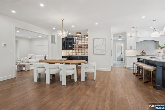 107 Rutland Rd, Glen Rock, NJ 07452 - dining room with baseboards, recessed lighting, dark wood-style flooring, and a chandelier