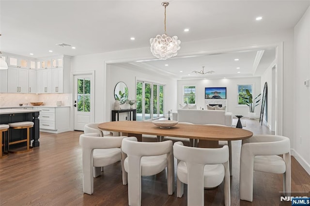 107 Rutland Rd, Glen Rock, NJ 07452 - dining area featuring recessed lighting, wood finished floors, a chandelier, plenty of natural light, and baseboards
