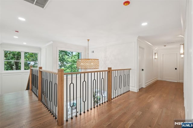 107 Rutland Rd, Glen Rock, NJ 07452 - hall with a decorative wall, wood finished floors, and recessed lighting