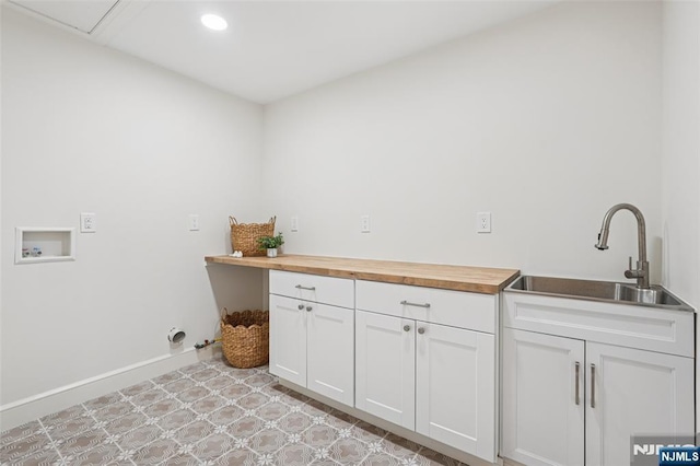 107 Rutland Rd, Glen Rock, NJ 07452 - laundry room featuring washer hookup, recessed lighting, baseboards, and cabinet space