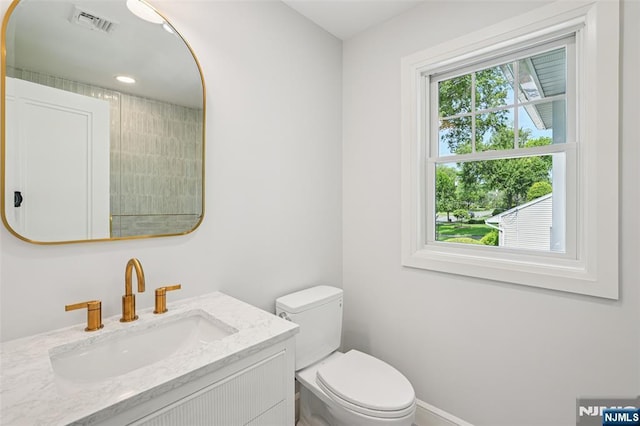 107 Rutland Rd, Glen Rock, NJ 07452 - bathroom with vanity, toilet, and baseboards