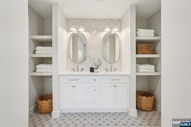 107 Rutland Rd, Glen Rock, NJ 07452 - full bathroom with double vanity, baseboards, and built in shelves