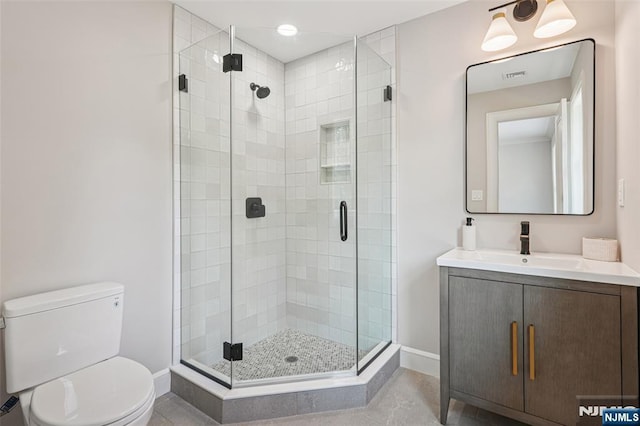 107 Rutland Rd, Glen Rock, NJ 07452 - bathroom featuring toilet, a stall shower, vanity, and baseboards