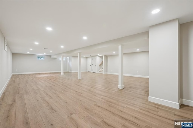 107 Rutland Rd, Glen Rock, NJ 07452 - finished basement featuring light wood-type flooring, stairway, recessed lighting, and baseboards