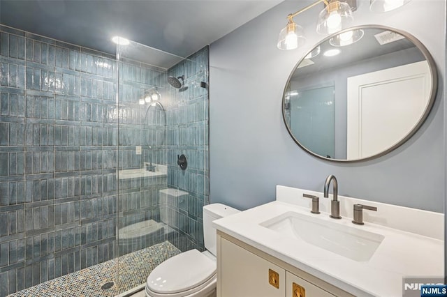 107 Rutland Rd, Glen Rock, NJ 07452 - bathroom featuring vanity, toilet, and tiled shower