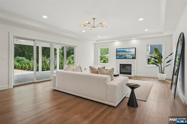 107 Rutland Rd, Glen Rock, NJ 07452 - living area with a tray ceiling, a chandelier, wood finished floors, recessed lighting, and a high end fireplace