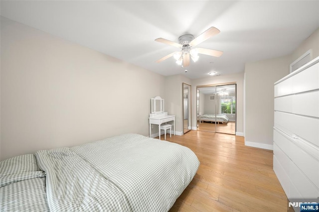 32 Mallard Ct, Englewood, NJ 07631 - bedroom featuring light wood finished floors, a closet, baseboards, and ceiling fan