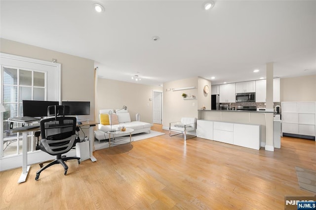 32 Mallard Ct, Englewood, NJ 07631 - living room with light wood-style flooring, a desk, recessed lighting, and baseboards
