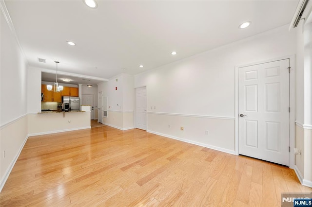 3326 Riverview Ave Unit 326, Englewood, NJ 07631 - unfurnished living room with light wood-type flooring, recessed lighting, baseboards, a chandelier, and ornamental molding