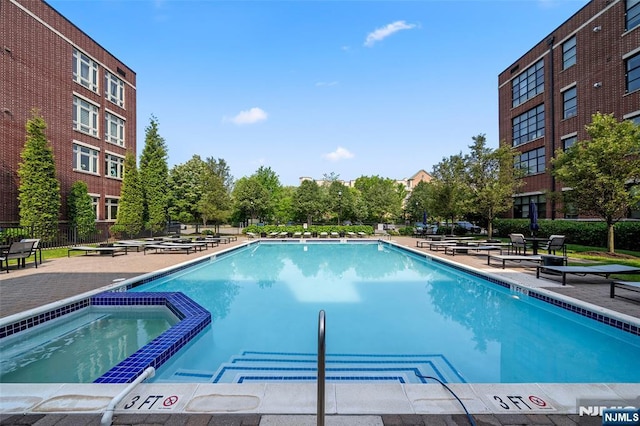 3326 Riverview Ave Unit 326, Englewood, NJ 07631 - view of swimming pool featuring a pool with connected hot tub and a patio