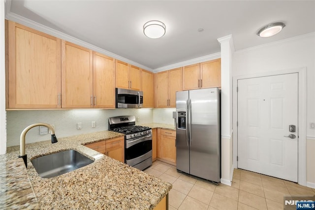 3326 Riverview Ave Unit 326, Englewood, NJ 07631 - kitchen with stainless steel appliances, a sink, light brown cabinets, crown molding, and light tile patterned floors