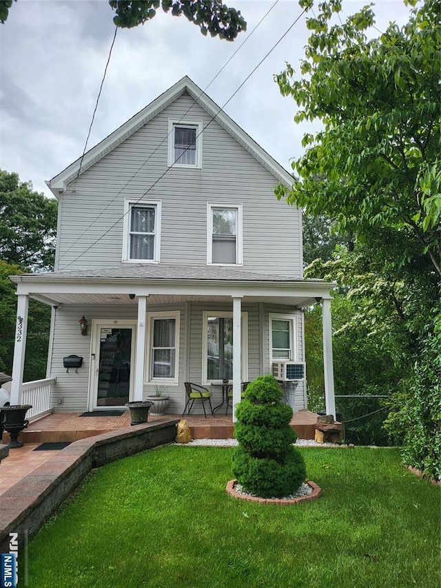 332 Summer St, Clifton, NJ 07011 - view of front facade with covered porch and a front lawn